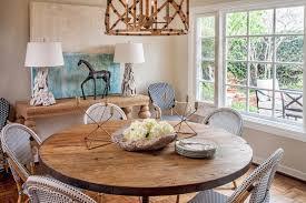 The table is made from gorgeous acacia wood and has a refined classic style to it that allows this table to match with any preexisting décor you currently have. Natural Wood Table White Wicker Chairs And Driftwood Lamps In Coastal Dining Room Hgtv