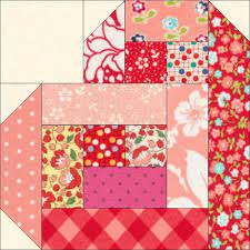 The colors in these log cabin blocks are similar in value, but each round is clearly visible because the colors are opposites on the color wheel. Scrappy Log Cabin Hearts Favequilts Com