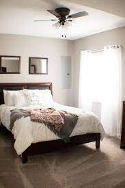 Guest Room Ideas Simple And Traditional Dark Wood Bed Frame With White Farmhouse Style Bedding And Comforter Dark Wood Bed Frame Wood Bed Set Wood Bed Frame