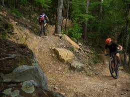 The trail's surface is gravel, dirt, and rock. Raccoon Mountain Mountain Biking