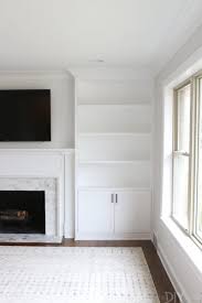 Browse 242 photos of built in cabinets around fireplace. White Built Ins Around The Fireplace Before And After The Diy Playbook