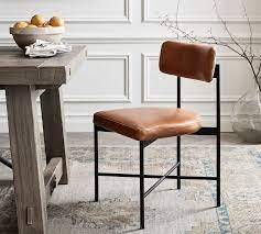 The rectangle dining table features a trestle style base, perfecting the rustic, farmhouse style. Maison Leather Dining Chair Leather Dining Side Chairs Dining Dining Chairs