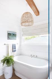 Basket Chandelier Above An Oval Vintage Bathtub In A Cottage Bathroom Nook Fitted With A Wall Mount Cross Handle Vintage Bathtub Cottage Bathroom Pure Products