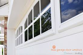 Garage door window inserts/grilles — divides a large pane of glass into smaller lites that mimic older, historical window unit styles. Install Faux Garage Windows