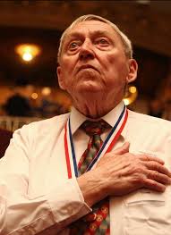 Iwo Jima veteran Ralph Swartsell stands for the playing