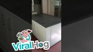 Often the area under a staircase can be neglected, dead space. Secret Wine Cellar Under Kitchen Island Viralhog Youtube