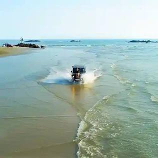 Driving along Muzhappilangad Beach, AI generated