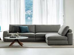 The pastel pink reflects the softness that wood had envisioned, and the green complements the plants, which in turn add vibrance to the space. Joey Sectional Sofa By Berto Design Castello Lagravinese