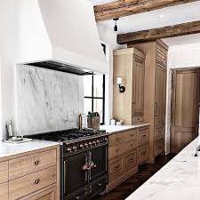 Black And Natural Wood Kitchen Cabinets Natural Wood Cabinets Bronze Hardware Plaster Hood Marble Slab Backsplash Black Range Marble Countertops Of Interior Design Kitchen Kitchen Interior Home