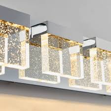 Vintage 4 light bath bar shown in aged silver finish with 4.5 clear bubble glass shade description: Artika Bubble Cube 4 Light Integrated Led Vanity Light