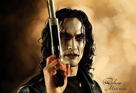 In The Crow just before Eric paints his face, he is sitting at the dresser  looking at memories of his life with Shelly, he pulls some pictures out of  a drawer and