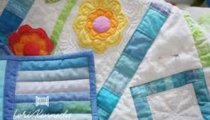 Floral vines in shades of pink, blue and green on a navy blue background. Quilting Applique Flowers And Leaves Lori Kennedy Quilts