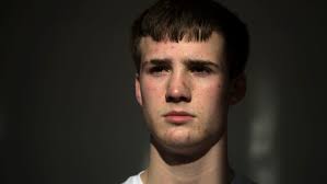 Wrestling with despair, state champ Natarcola lifted Smyrna community