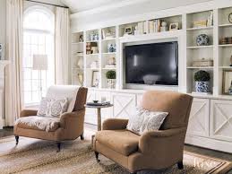 Lillian August Club Chairs And Cocktail Table By Bliss Studio Sit In Front Of A Custom Bookcase Wall Living Room Bookcase Family Room Living Room Built Ins