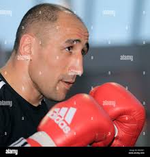 In this March 3, 2014 photo, Abraham Lincoln High School principal Barnaby  Payne listens as Bill Sanderson, executive director at San Francisco  Unified School District speaks in Payne's office in San Francisco.