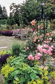 Royal National Rose Society Gardens The Gardens Of The Rose Hertfordshire Uk Garden Seat Surrounded By Roses 7 Of 12 Rose Garden Landscape Beautiful Gardens Cottage Garden