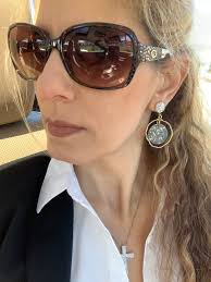 Gorgeous hand gunmetal gold painted leather with hammered gold hoop  earrings.