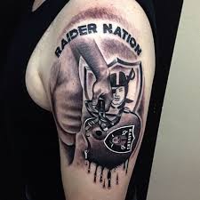 Female oakland raiders logo with flowers tattoo for girls. Melting Oakland Raiders Helmet Left Half Sleeve Tattoo