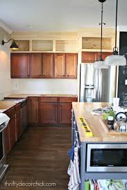 Friends, if you ever find yourself contemplating whether or not to have your kitchen cabinets extend to the ceiling, do it. Building Cabinets Up To The Ceiling From Thrifty Decor Chick