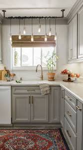 A white kitchen with a grey tile backsplash and a blue kitchen island plus white stone countertops is chic. 50 Light Gray Kitchen Cabinets Cool Moody Grey Cabinets