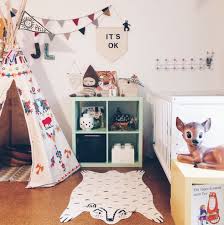 The geometric print of the rug contrasts with the balloons of the wallpaper. Eclectic Kids Rooms Design Dazzle