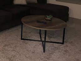 It has a smooth, gray laminate top and black metal, open frame legs. Household Essentials Ashwood Round Coffee Table Walmart Com Walmart Com