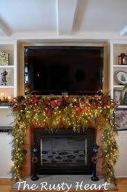 How to decorate a mantel with tv above for christmas. Photo Who Says You Can Not Have A Beautiful Christmas Mantel Even With A Large Tv A Christmas Fireplace Decor Christmas Fireplace Christmas Mantel Decorations