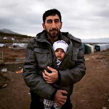 UNHCR, the UN Refugee Agency - Safe in his father's arms. A Syrian refugee  holds his baby son in a refugee camp in Iraq. Sadly, as the Syrian conflict  enters its 5th