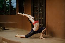 Crescent moon yoga pose photo gallery. Young Woman Doing Crescent Moon Yoga Pose By Zhph Production