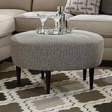 The use of holofiber is particularly ideal for making it cozy. Bassett Rory Contemporary Round Ottoman With Tapered Legs Bassett Of Cool Springs Ottomans