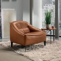 Set up a leather club chair beside a bookcase filled with Modern Armchairs Contemporary Armchairs Uk Amode London