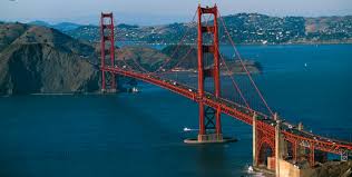 The international orange of the golden gate bridge glows in the evening light at sunset in the bay area. Golden Gate Bridge All You Need To Know Civilengineeringbible Com