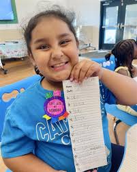 That smile says it all! 📝✨ This amazing student just aced her spelling  test, and you can see how proud she is of her hard work paying off! Our  tutoring support helped