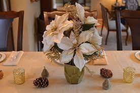 Christmas Centerpiece White Poinsettia Pinecones And Pears Christmas Centerpieces Christmas Wedding Centerpieces Poinsettia Centerpiece