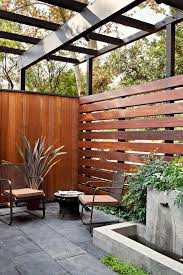 Who are the contemporary fencing company? Privacy Fencing Ideas Patio Traditional With Wooden Fence Contemporary Path Lights