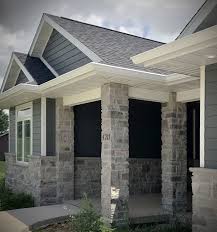 Craftsman Home Modern Exterior Blue Siding Stone Veneer Pillar Porch In 2020 Stone Porches Craftsman Home Exterior Modern Farmhouse Exterior