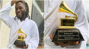 ^ justin bieber is a canadian musician and burna boy, a nigerian, appears as a featured artist on one of the songs on the album. Burna Boy Drinks Champagne From His Grammy Awards Plaque In A Club