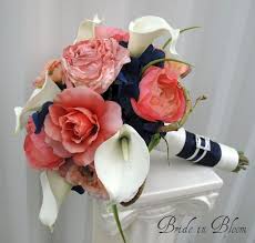 The bridal flower worked with me and even made a custom listing for my girlies. Bride In Bloom Navy Blue Coral Wedding Bouquets Coral Bouquet Wedding Blue Coral Weddings Silk Flowers Wedding