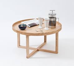 A heavy, solid dark oak coffee table constructed from 3 oak beams, with a further 2 shorter beams for bases. Wireworks 66d Round Table Natural Oak