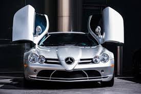 Manny enjoys the gadgets in the slr as a child and most of all he likes the engine start button hidden under a flap located on the gearbox. Barrett Jackson Countdown 2005 Mercedes Benz Slr Mclaren Classiccars Com Journal
