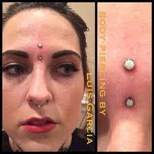 Fresh Vertical Bridge With An Anatometalinc Flat Body Piercing By Luis Garcia Bridge Piercing Piercings Unique Face Piercings