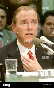 Former Enron CEO Jeffrey Skilling, right, stands beside his attorney Daniel  Petrocelli as he makes a point to the media as they leave the federal  courthouse in Houston Wednesday, Aug. 11, 2004. Skilling wants another year  and a half to prepare for what ...