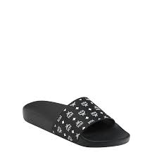 White circle outlined in black with upwards pointing arrow in center. 35 It Women S Slides In Monogram Rubber Black Mcm De