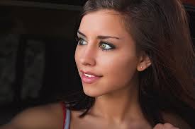 Beautiful woman looking down the road by James Brey