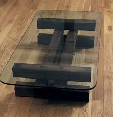 Its tempered glass top sits atop four sleek rounded legs, which in turn sit atop white manufactured wood legs, with a tempered glass lower shelf perfect for hosting extra magazines or. 36 Wood And Glass Coffee Tables Ideas Coffee Table Coffee Table Design Glass Coffee Table