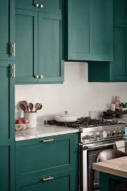 These Painted Kitchen Cabinets Are A Rich Emerald Green That Is Accented Beautifully With Bra Green Kitchen Walls Painted Kitchen Cabinets Colors Green Kitchen