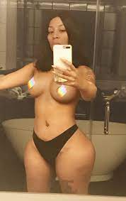 K. Michelle puts her boobs & curves on display in racy new selfie