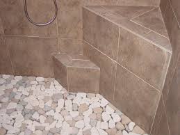River rock on bathroom walls can appear dramatic or subtle, depending on how you use it. Pebble Shower Floors For Tiled Showers How To Install Small Rocks Tile Your World