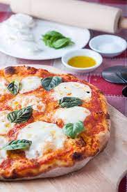 Stone Baked Margherita Pizza On The Bbq Photos Food Recipe Margherita Pizza Pizza Stone Recipes Recipes