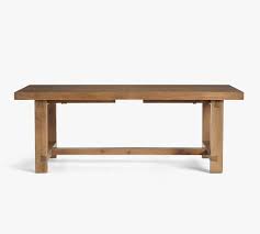 Dining tables are multifunctional spaces for eating, working, socialising and playing. Reed Extending Dining Table Pottery Barn